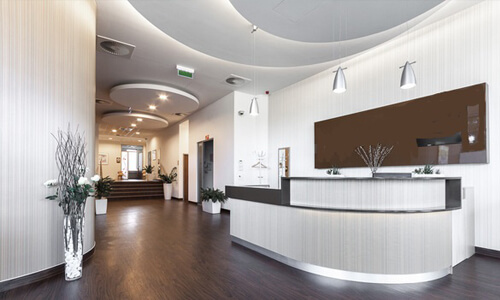 Picture of a dental office interior representing the dental services of the Costa Rica Dental Centre in San Jose, Costa Rica.  The interior is very modern and has soft brown and white colors.